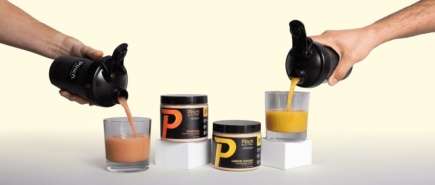 Both Pinch flavors, Tropical and Lemon Ginger, poured from shaker bottles into glasses beside the two jars